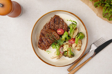 Portion of gourmet beef steak with vegetable salad