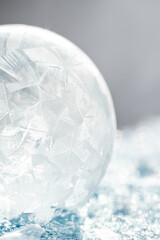 Beautiful frosty patterns on frozen soap bubble. winter, frosty background. Macro photo