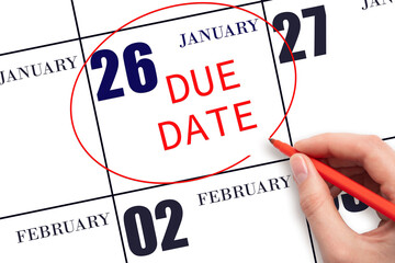 Hand writing text DUE DATE on calendar date January 26 and circling it. Payment due date