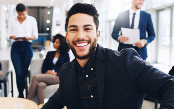 Happy, Portrait And Young Businessman In Office With Colleagues On Meeting Break In New York, USA. Gen Z, Corporate And Professional Person In Workplace With Optimistic Smile For Job Satisfaction.