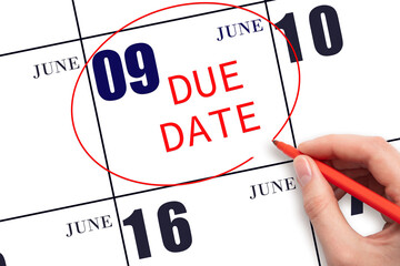 Hand writing text DUE DATE on calendar date June 9 and circling it. Payment due date