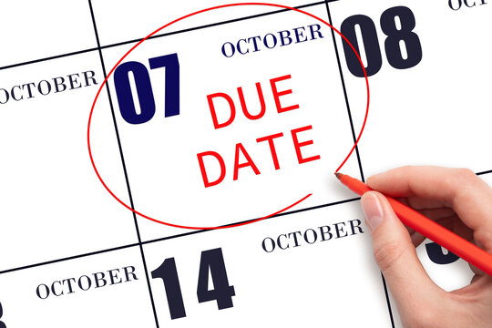 Hand writing text DUE DATE on calendar date October 7 and circling it. Payment due date
