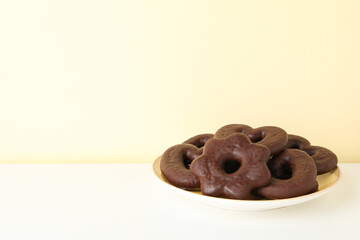 Concept of tasty bakery, gingerbread cookies in chocolate, space for text