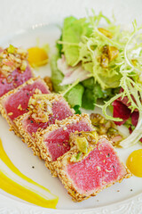 sliced tuna steak with sesame and vegetables
