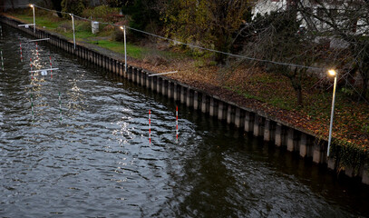 racing slalom goals for canoe and raft, kayak. Racing track with suspended striped bars on a wild and calm river. both beginner and advanced paddler ride