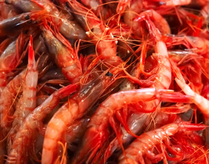 Raw fresh shrimps in a pile at a seafood market