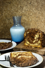 Delicious homemade marble pound cake with bottle of milk and hazelnuts