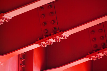 Red steel bridge span, bottom view