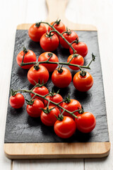 Fresh cherry tomatoes on slate plate