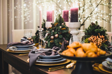 Christmas Eve table decorations, Christmas mood, Christmas tree on the dining table. Defocused
