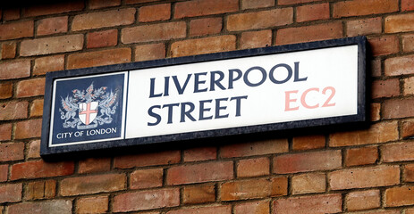 Liverpool Street sign on a brick wall in London, UK. 