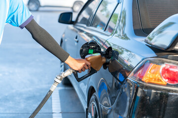 Man Refill and filling Oil Gas Fuel at station.Gas.