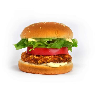 Schnitzelsemmel mit Tomaten und Salat