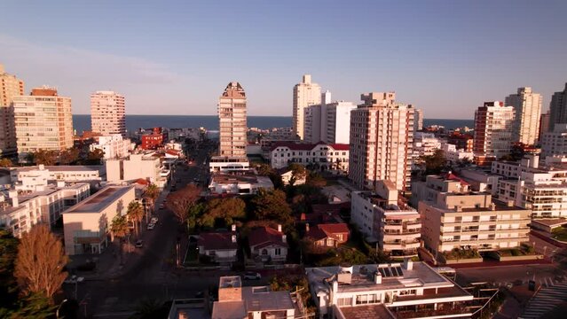 Aerial view on coastal city in Punta Del Este, Uruguay on sunset. High quality 4k drone footage