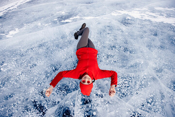 Tourist woman background ice with gas methane bubbles lake Baikal. Adventure winter travel top view