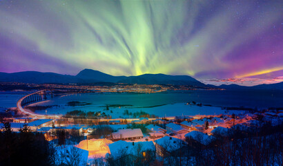 Aurora borealis or Northern lights in the sky over Tromso - Tromso, Norway