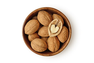 Shelled walnuts with half heart shaped walnut in wooden bowl on white background - 548960231