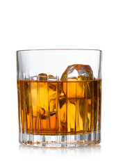Crystal old fashioned glass with whiskey and ice cubes on white background.