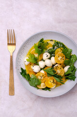 Yellow tomatoes, mozzarella and parsley