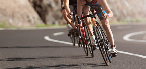 Cycling competition, cyclist athletes riding a race at high speed