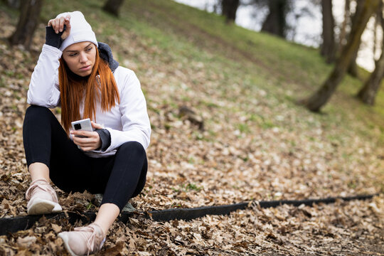 Young girl after workout in park, autumn day stock photo
