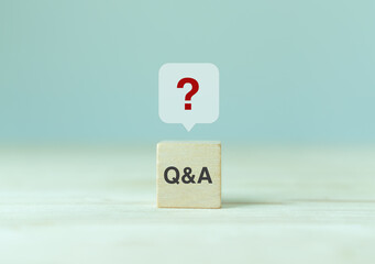 Q and A - an abbreviation of wooden blocks with letters on a gray background. Illustration for...