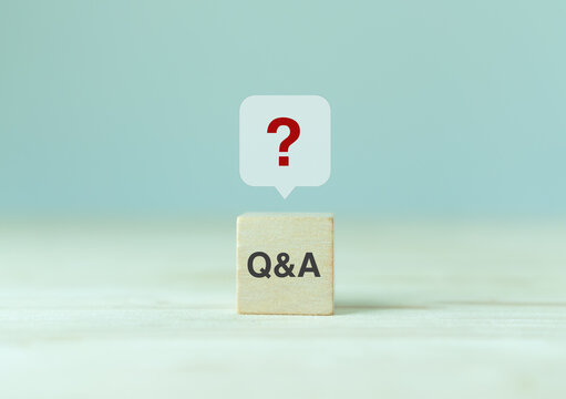 Q and A - an abbreviation of wooden blocks with letters on a gray background. Illustration for frequently asked questions concepts in websites, social networks, business pages. Business concept.
