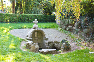 Old fountain in the park of Penmarch