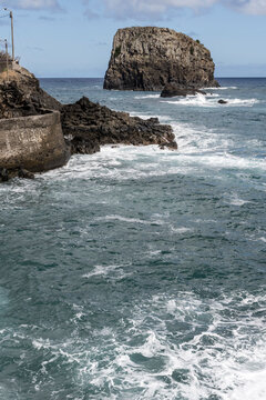 ocean waves dashing on volcanic cliffs at Porto de Cruz, Madeira