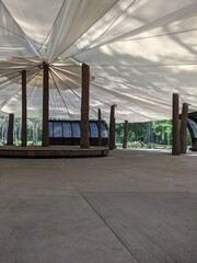 scene in an open-air park with an awning from rain and sun