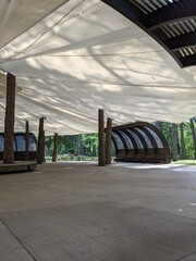 scene in an open-air park with an awning from rain and sun