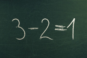 Simple math equation 3 minus 2 equals 1. Mathematics learning and school formulas. Handwritten on...