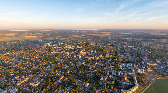 Votkinsk, Russia. Panorama of the city. Sunset time. Aerial view. The Kama River on the horizon © nikitamaykov