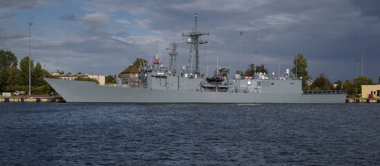 MISSILE FRIGATE - A warship at a naval base