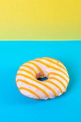 Fototapeta na wymiar glazed donut on colorful background