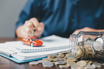 Concept of car insurance business, saving buy - sale with tax and loan for new car. Car toy vehicle...