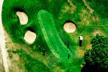 Top down aerial view of greenery golf court in the Algarve, Portugal