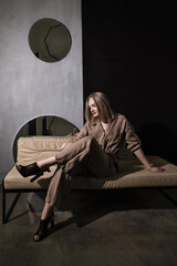 Girl in casual outfit posing in loft space