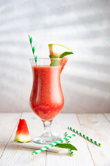Tasty watermelon cocktail with mint on white background