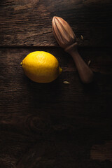 Fresh lemons in dark mood on black background