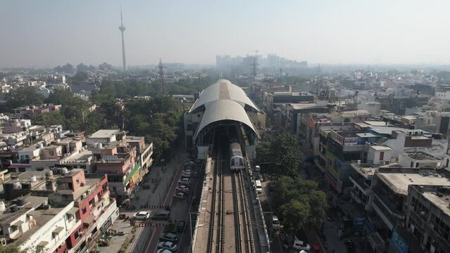 Aerial Drone shot of Delhi Metro Train at  
Netaji Subhash Place Pitampura tv tower Kohat Enclave metro station