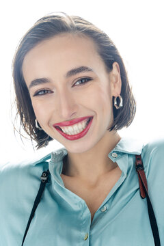 Portrait of a beautiful smiling young woman with short brown hair