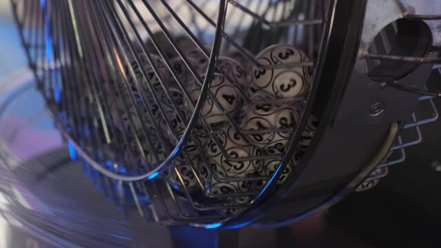 Balls with numbers rotate in a lottery machine