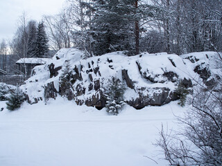 Snow-covered rocks and trees in Norway