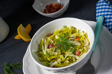 White cabbage with dill and diced bacon