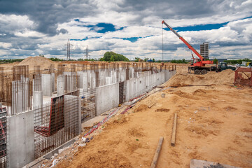 Column formwork and crane on house construction.