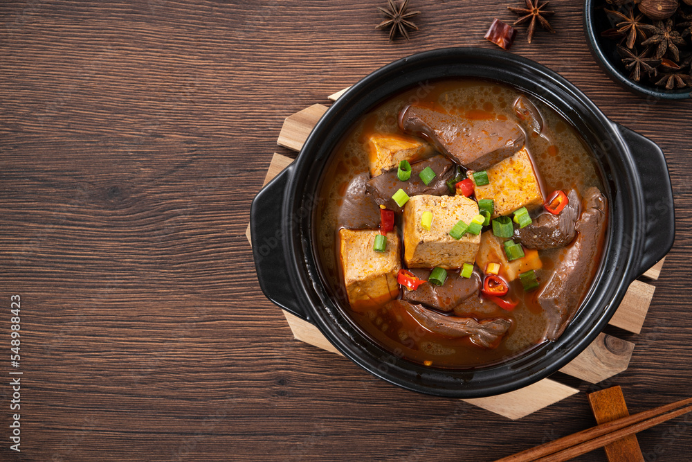 Wall mural spicy duck blood jelly soup and stinky tofu with scallion and chili pepper topping.