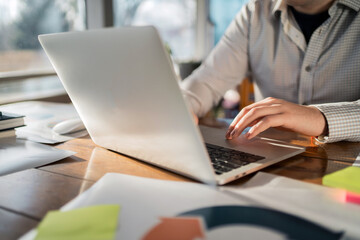 A man works on a computer in an office workplace favorite thing