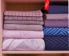 Multi-colored, soft textile, terry towels in a textile store
