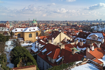 Prague, Czech Republic. Winter Prague with Mala Strana district in the foreground and districts of the right bank of Vltava river in the background. High angle view from the Prague Castle.